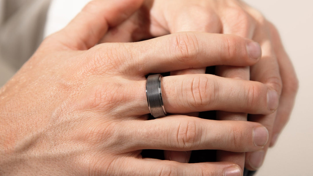 tungsten vs titanium vs platinum — silver-matte tungsten band on a man's hand, FoundryCut Ingot