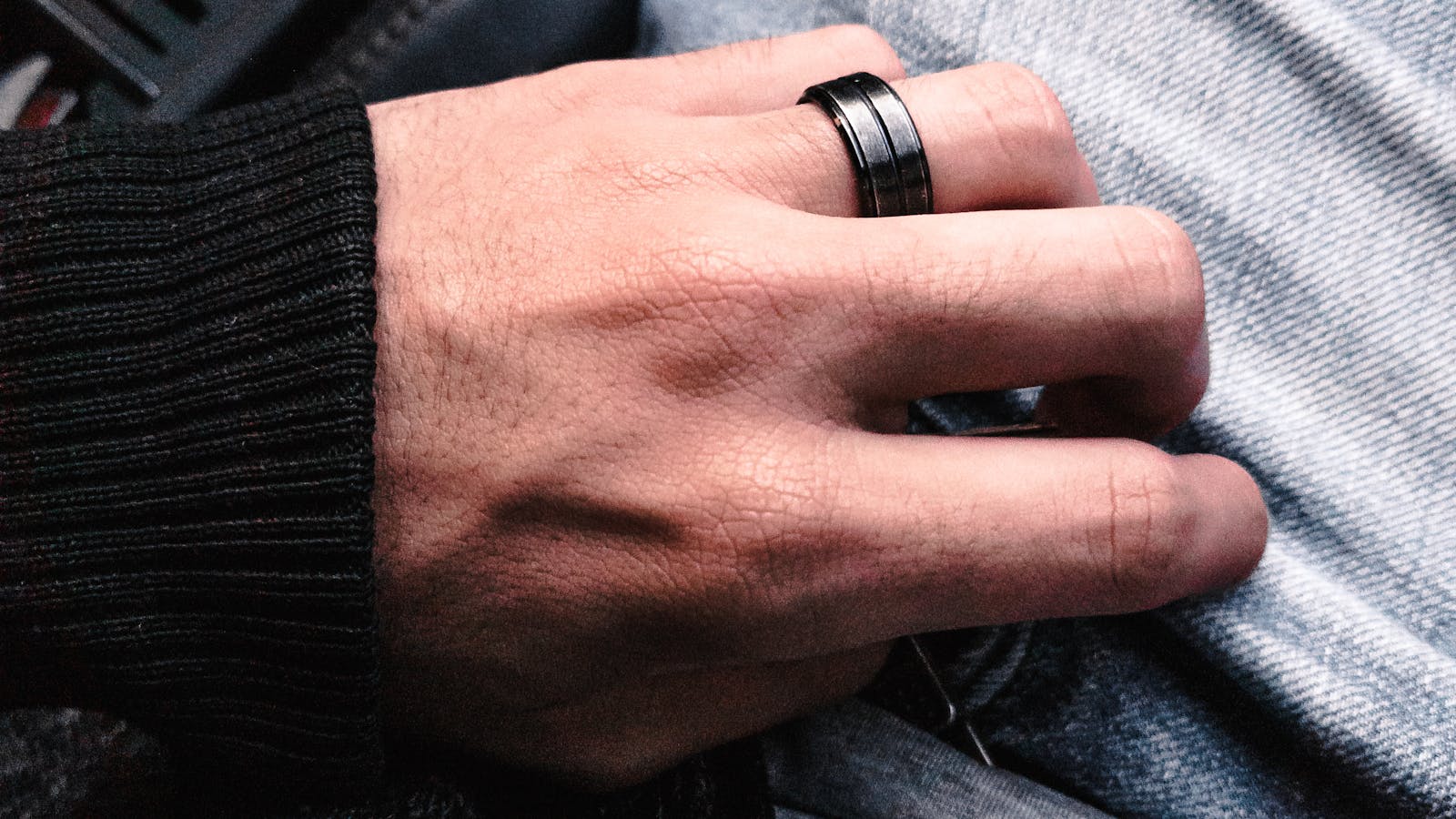 best wedding band for men — man wearing a black tungsten wedding band — FoundryCut