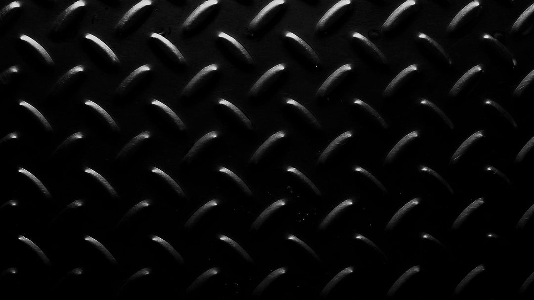 Dark forged steel diamond plate backdrop for a guide on how to get a ring off a swollen finger