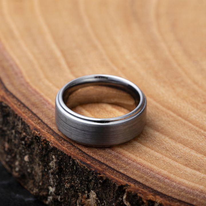 Silver-Tungsten-Ring-Wood-Background-Photo