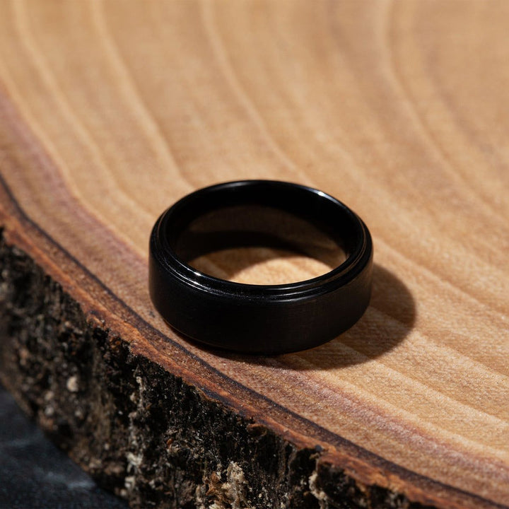 Monolith tungsten wedding band styled — lifestyle detail